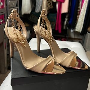 Gold heels with “Lock🔒” detail